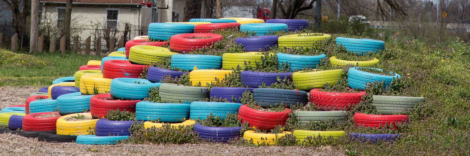 colorful tires stacked on hill