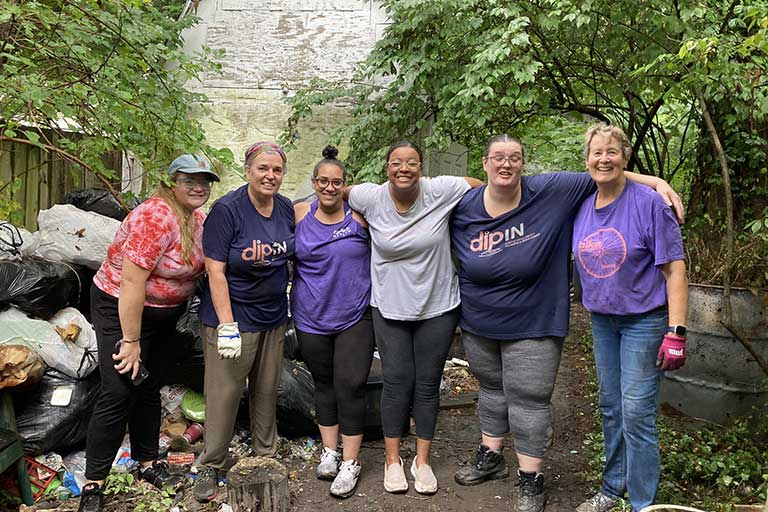 DIP-IN Eskenazi CHWs pictured at a NeighborLink volunteer event in the Near West Community in 2022
