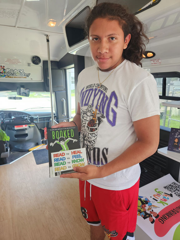 community member holding book