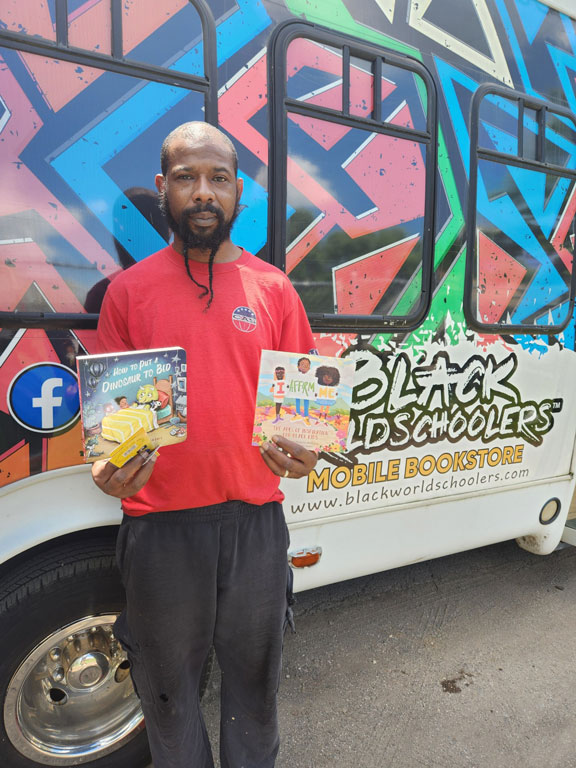 community member holding two books