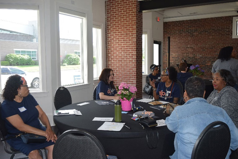 community members sit around a table at the steering committee meeting
